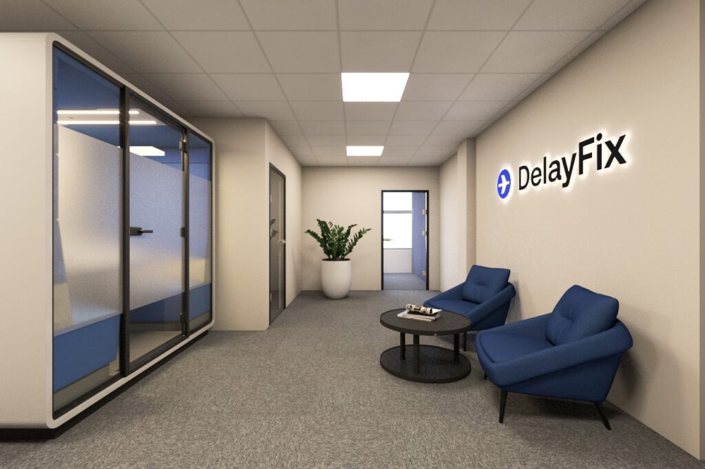 Wnętrze biura DelayFix z profesjonalną strefą recepcyjną, designerskimi meblami w kolorze niebieskim i charakterystycznym logo DelayFix